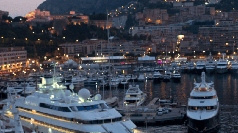 Luxury yachts Monaco harbor at night