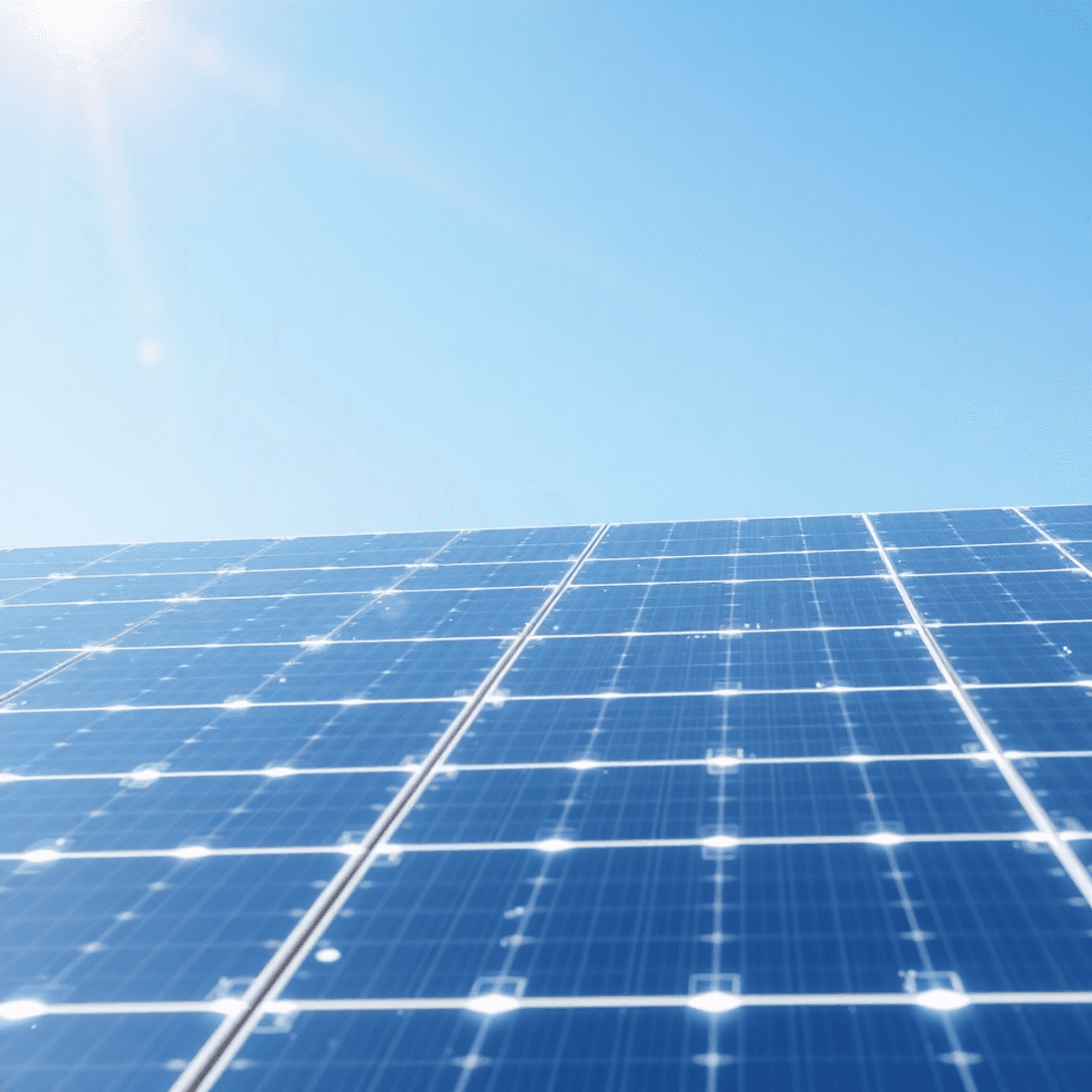 Futuristic solar panels under a clear sky with glowing crystalline structures and light rays symbolizing advanced renewable energy technology.