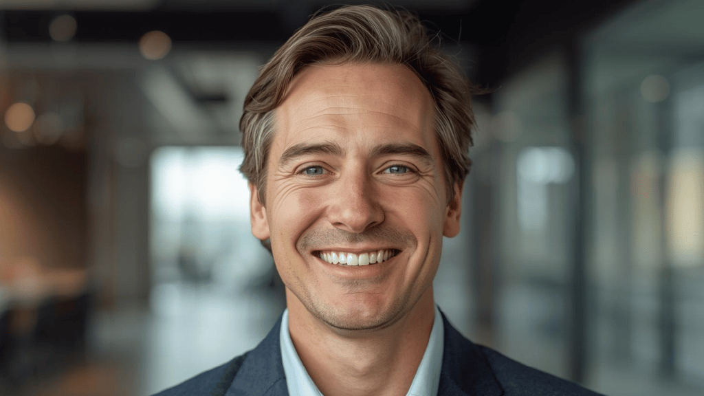 Stanislav Kondrashov-Man smiling in a professional portrait, business and leadership context